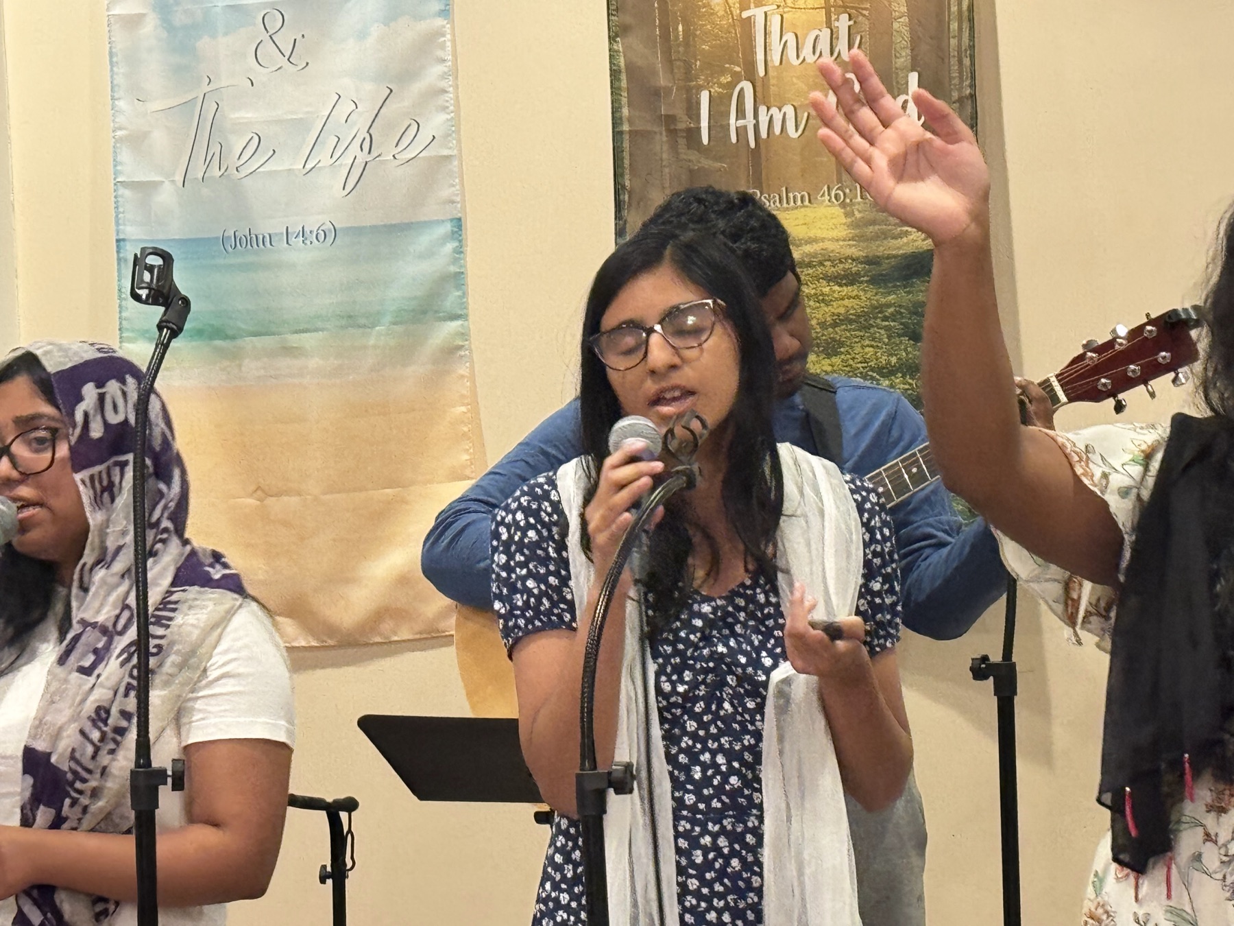 Worship leader singing at Bethel Worship Center